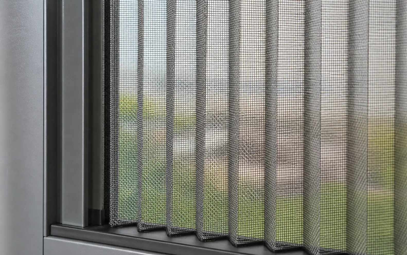 Close-up of SS304 metal pleated screen mesh on a window in Hyderabad