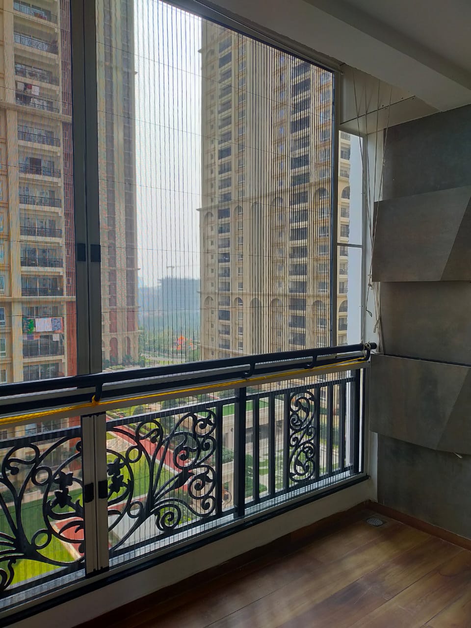 Dual panel pleated balcony screen Hyderabad — bi-parting accordion screen